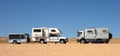 An imported German motor home camping beside a camper van at lake powell