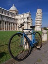 bicycle in front of the famous Leaning Tower of Pisa in Tuscany, Italy Royalty Free Stock Photo