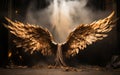 Imposing bronze angel wings open wide in a dramatic display set against a moody theatrical backdrop with a mystical foggy glow