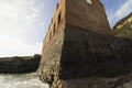 The imposing crumbling remains of the accommodation and workshop building, Porth Wen Brickworks, Scheduled Monument, Anglesey