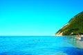 Scenery from Spiaggia della Capannina with Scoglio della Vela and Mount Conero Royalty Free Stock Photo