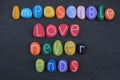 Impossible love never ends, creative message with colored stone letters