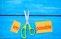 Impossible Is Possible Concept. card with the text impossible, scissors cut a word to them. success and challenge concept. I can, Royalty Free Stock Photo
