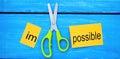 Impossible Is Possible Concept. card with the text impossible, scissors cut a word to them. success and challenge concept. I can, Royalty Free Stock Photo