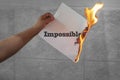 Impossible text on fire on paper