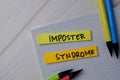 Imposter Syndrome text on sticky notes isolated on office desk Royalty Free Stock Photo