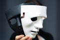 Impostor mask, spy, falsification of documents, illegal actions, identification of fake personalities, data protection from theft Royalty Free Stock Photo