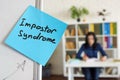 Impostor syndrome written on the sticker on the whiteboard.