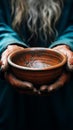 Impoverished elderly hands hold empty bowl, selective focus reveals hungers impact