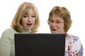 Impressed women looking at computer screen Royalty Free Stock Photo