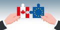 AECG symbol and Canada-Europe trade agreement, with two hands holding puzzle pieces in the colors of their countries.