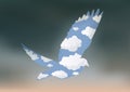 Symbol of the dove of peace whose silhouette makes a blue sky appear during a stormy weather. Royalty Free Stock Photo