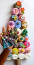 Impression Christmas decoration, top view woman hand making simple Christmas tree