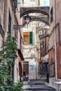 Impression of the narrow street Via Saccheri in the center of the Italian town San Remo