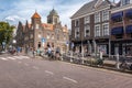 Impression of a street in the old center of Delft with the tower of the City Hall Delft in the background Royalty Free Stock Photo