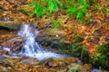 Impressionistic Style Artwork of an Autumn Waterfall