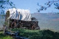 Impressionistic Style Artwork of a Covered Wagon At The Edge Of The Desert