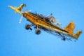 Impressionistic Style Artwork of a Yellow Crop Dusting Plane Flying in a Blue Sky