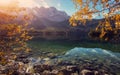 Impressive Autumn landscape The Eibsee Lake in front of the Zugspitze under sunlight. Amazing sunny day on the mountain lake. Royalty Free Stock Photo