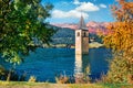 Impressive autumn view of Tower of sunken church in Resia lake. Amazing morning scene of Italian Alps, South Tyrol, Italy, Europe.