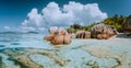 Impressive cloudscape at beautiful Anse Source d`Argent beach, La Digue Island, Seychelles. Spectacular location