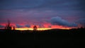 Impressive cloudscape over a misty evening landscape