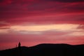 Impressive cloudscape, over the silhouette of mountain and tree