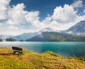 Impressive cloudy sky above Champfer lake in the Swiss Alps. Foggy summer scene of Switzerland, Alps, Europe. Traveling concept
