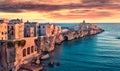 Impressive evening cityscape of Vieste - coastal town in Gargano National Park, Italy, Europe. Fantastic summer sunset on Adriatic Royalty Free Stock Photo