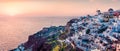 Impressive evening panorama of Santorini island. Picturesque spring sunset on the famous Greek resort Oia, Greece, Europe. Royalty Free Stock Photo