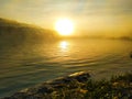 Impressive golden sunrise over the pool, beach in the foreground