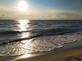 Impressive golden sunrise over the sea with beach in the foreground. Conceptual design