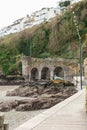 Impressive historic entrance to Looe harbor at low tide.