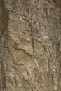 Impressive huge steep wall in a surface quarry, stone texture Royalty Free Stock Photo