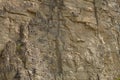 Impressive huge steep wall in a surface quarry, stone texture Royalty Free Stock Photo