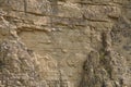 Impressive huge steep wall in a surface quarry, stone texture Royalty Free Stock Photo