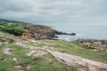 Impressive landscape along the coastline in the Basque country with rocks and green fields Royalty Free Stock Photo