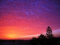 Impressive but real sunset with incredible colors, from violet to blue to yellow, in the sky of Costa Teguise in Lanzarote, Canary Royalty Free Stock Photo