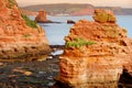 Impressive red sandstones of the Ladram bay on the Jurassic coast, a World Heritage Site on the English Channel coast of southern Royalty Free Stock Photo