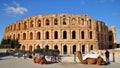 The impressive Roman amphitheater of El Jem, with camels in the foreground