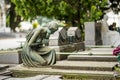Impressive sculptures on the tombs and monuments of Cimitero Monumentale di Milano or Monumental Cemetery of Milan. Milan, Italy Royalty Free Stock Photo