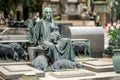 Impressive sculptures on the tombs and monuments of Cimitero Monumentale di Milano or Monumental Cemetery of Milan. Milan, Italy