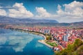 Impressive spring cityscape of Pogradec town. Beautiful outdoor scene of Ohrid lake Royalty Free Stock Photo