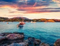 Impressive spring scene of the Nuevo Loca Beach, Aegean sea. Dramatic evening view of the Anavyssos town, Greece, Europe. Royalty Free Stock Photo