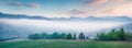 Impressive summer sunrise in Carpathian mountains. Misty morning panorama of green mountain valley, Transcarpathian, Rika village Royalty Free Stock Photo