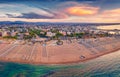 Impressive summer view from flying drone of Libera Rimini public beach.