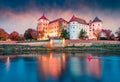 Impressive sunrise view of Hartenfels castle. Splendid morning view of Torgau town on the banks of the Elbe in northwestern Saxony