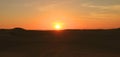 Impressive Sunset over the Sand Dunes of Huacachina Desert with the Dune Buggy Wheels Prints in the Sand, Ica region, Peru