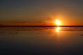 Impressive sunset reflection on the flooded Uyuni Salt Flats of Bolivia, South America Royalty Free Stock Photo
