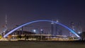 Impressive view of the Dubai city center with skyscrapers, bridge, and lights in the evening, UAE